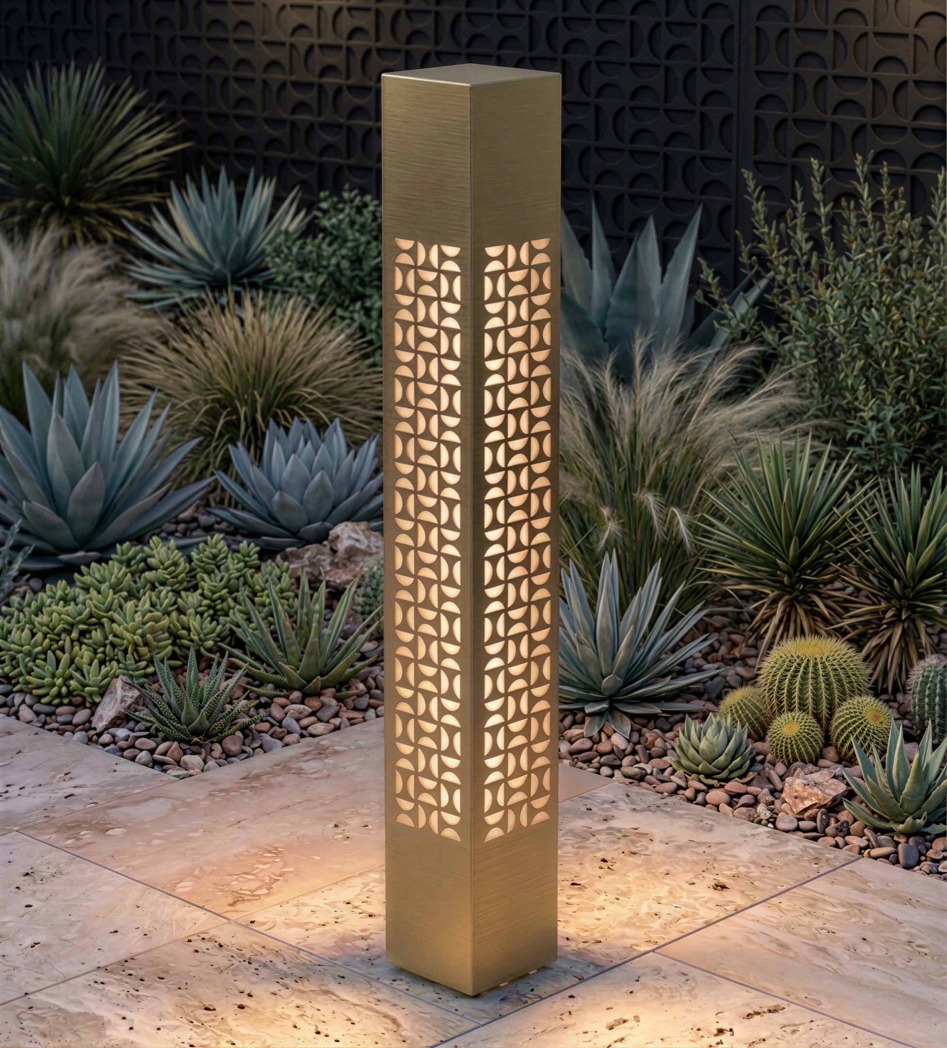 Translucent brass MOTIF pedestal in a desert garden at night